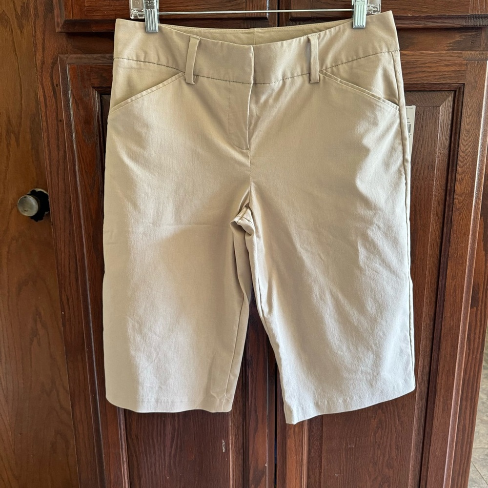 B. Wear tan Bermuda shorts